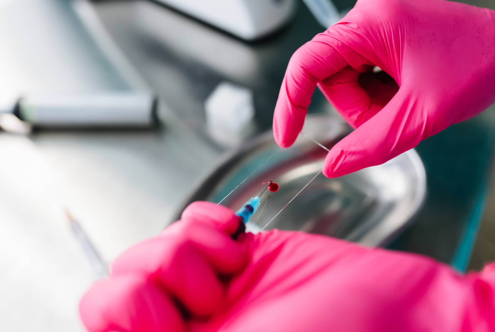 Closeup view of a scientist using with safety a sample glass holder